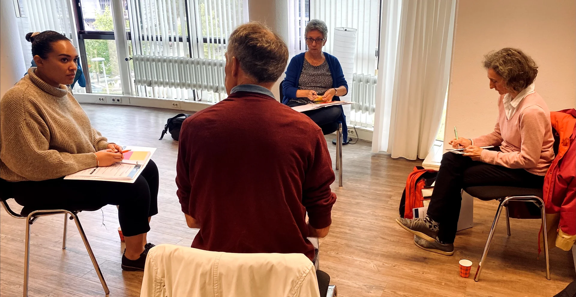 Deelnemers in gesprek tijdens incompany training